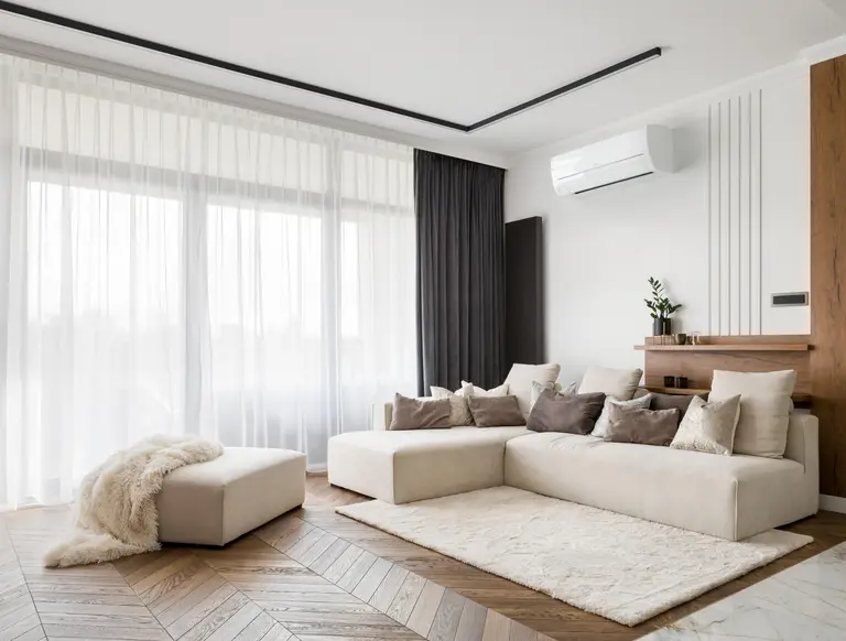 Wall-mounted air conditioning unit in a stylish modern living room