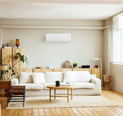 Bright open-plan living room with a modern split-system air conditioner